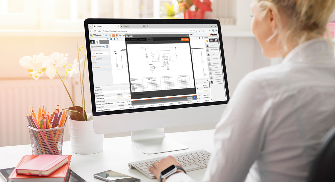 Una persona alla scrivania utilizza il software TiSystem 8 su un computer per visualizzare uno schema di circuito elettronico.